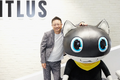 Photo of Atlus CEO Osamu Ohashi with a Morgana mascot