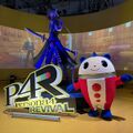 Costumed Teddie mascot and statue of Izanagi