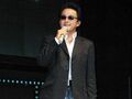 Okada speaking for the Shin Megami Tensei: Nine panel at the Xbox booth