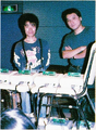 Photo of Tsukasa Masuko with Super Famicom consoles.