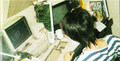Photo of Tsukasa Masuko working at his desk.